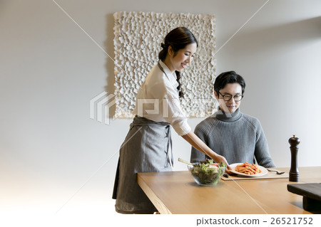 A woman preparing meals 26521752