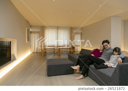 A family relaxing in the living room 26521872