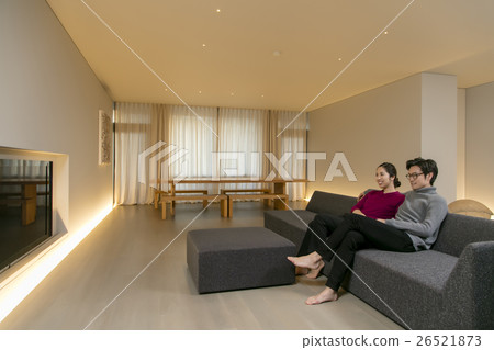 A family relaxing in the living room 26521873