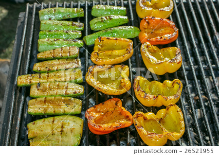 Charcoal grill with vegetables peppers zucchini Charcoal grill with vegetables peppers zucchini 26521955