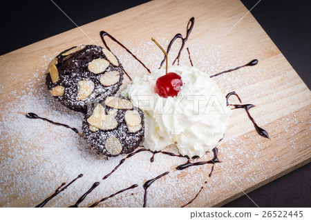 Brownies and whipped cream with cherry on top Brownies and whipped cream with cherry on top 26522445