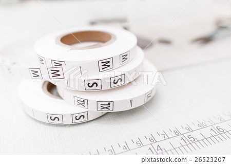 Several size tag tapes on white background 26523207