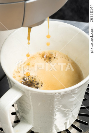 Coffee being dripped in coffee maker 26528144