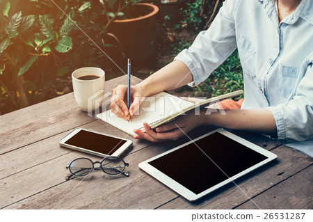 Young business woman hand with pencil writing 26531287