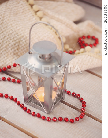 Christmas still life with lantern and red beads  26533600