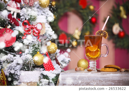 Hot winter tea with spices on a rustic table Hot winter tea with spices on a rustic table 26533622