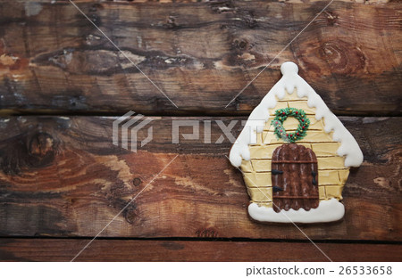 Christmas gingerbread house on wooden background. 26533658