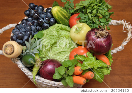 White basket with fresh vegetables and fruit 26534120