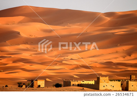 Berber homes at the foot of sand dunes of Merzouga 26534671