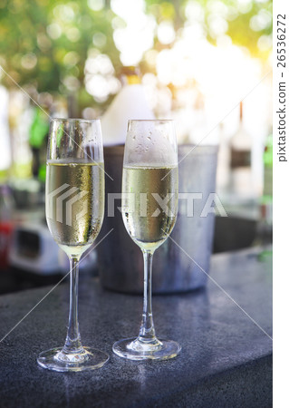 Glasses of champagne in outdoor resort bar 26536272