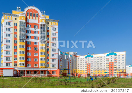 Playground in front of multi-storey house 26537247