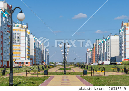 Central alley with lanterns in new neighborhood Central alley with lanterns in new neighborhood 26537249