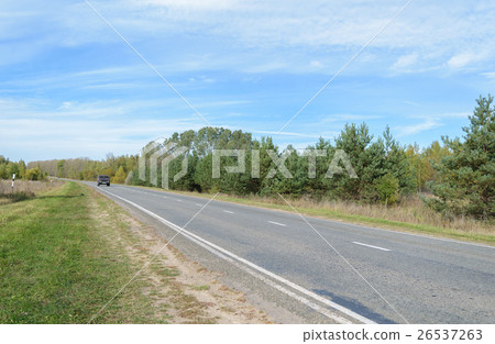 Asphalt highway with white intermittent markings Asphalt highway with white intermittent markings 26537263