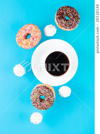 Cup of coffee with donuts and meringues in motion Cup of coffee with donuts and meringues in motion 26538148
