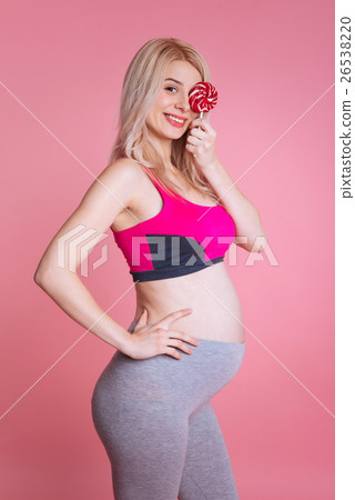 Joyful pregnancy holding a lollipop on the left 26538220