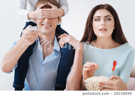 Nice positive man holding his daughter on the 26538949