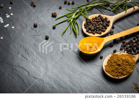 Stock Photo: spices and herbs over black stone background