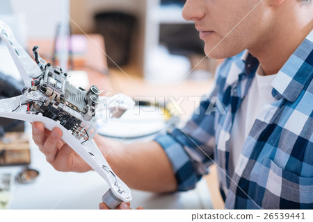 Close up of a young man discovering drone detail 26539441