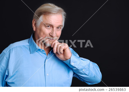 Smiling pensioner holding his hand on the beard Smiling pensioner holding his hand on the beard 26539863