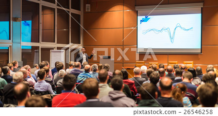 Business speaker giving a talk in conference hall. 26546258