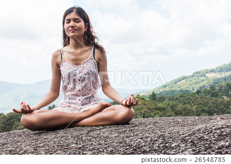 Young woman practicing yoga on natural background Young woman practicing yoga on natural background 26548785