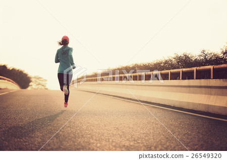 young fitness woman runner athlete running at road 26549320