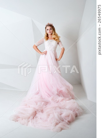 Beautiful blonde woman wearing gorgeous long dress 26549975