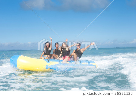 A fellow who enjoys a vacation banana boat 26551123