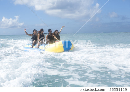 A fellow who enjoys a vacation banana boat 26551129