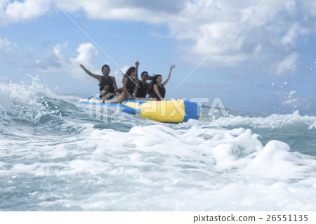 A fellow who enjoys a vacation banana boat 26551135