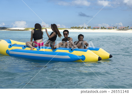 A fellow who enjoys a vacation banana boat 26551148