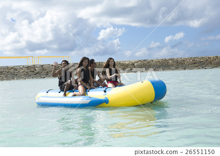 A fellow who enjoys a vacation banana boat 26551150