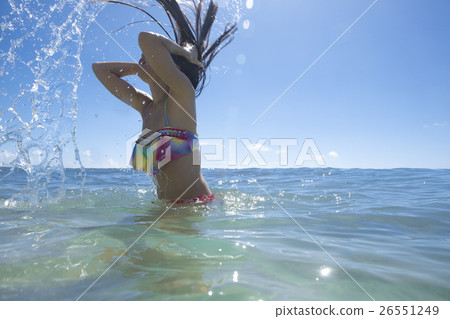 A woman enjoying resort sea bathing 26551249