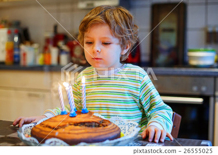 Little kid boy celebrating his birthday and 26555025