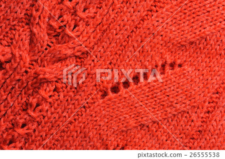 Closeup of knitted ornament on woolen texture Closeup of knitted ornament on woolen texture 26555538
