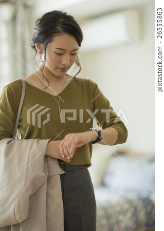 A young woman before going to work A young woman before going to work 26555863