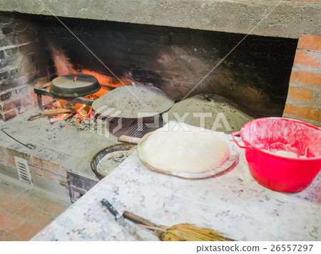 Old traditional stone bread oven stove with 26557297