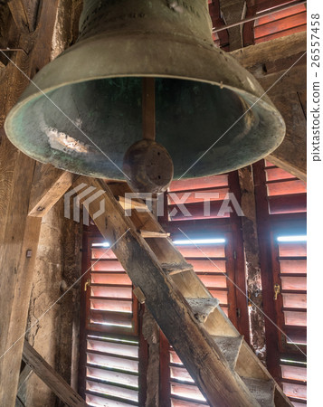 Detail of an old church bell in the red wooden 26557458