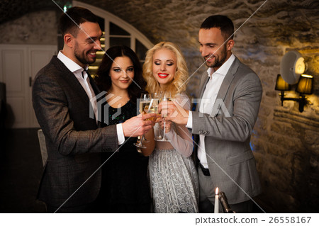 Four friends celebrating Four friends celebrating 26558167