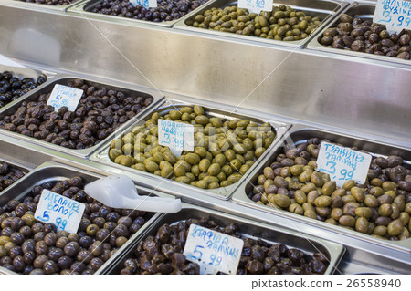 Olives and olive oil for sale at a market  26558940