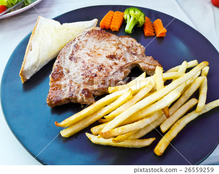 grilled pork chop (neck cut) with bread grilled pork chop (neck cut) with bread 26559259
