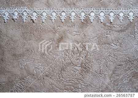 white lace border on a beige cement background white lace border on a beige cement background 26563787