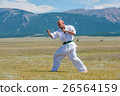 Man in white kimono and black belt training kung 26564159