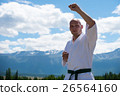 Man in white kimono and black belt training kung 26564160
