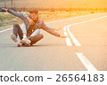 The guy with the girl drive to longboard on a 26564183