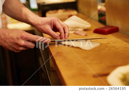 The hands of craftsmen who handles sashimi The hands of craftsmen who handles sashimi 26564195