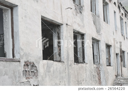 White wall of an abandoned building. Broken White wall of an abandoned building. Broken 26564220