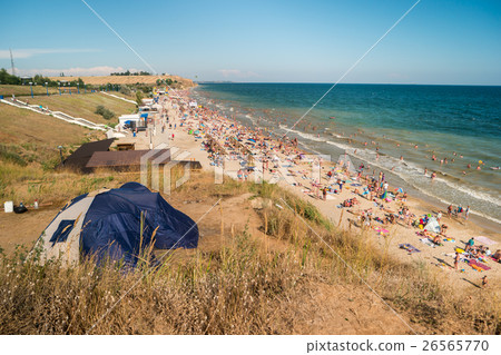 Crowded beach at daytime. Crowded beach at daytime. 26565770