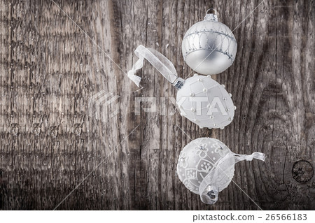 White christmas balls on a wooden background White christmas balls on a wooden background 26566183