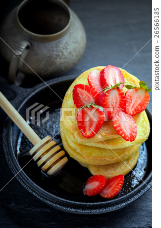 Stack of sweet pancakes with strawberry and honey. Stack of sweet pancakes with strawberry and honey. 26566185